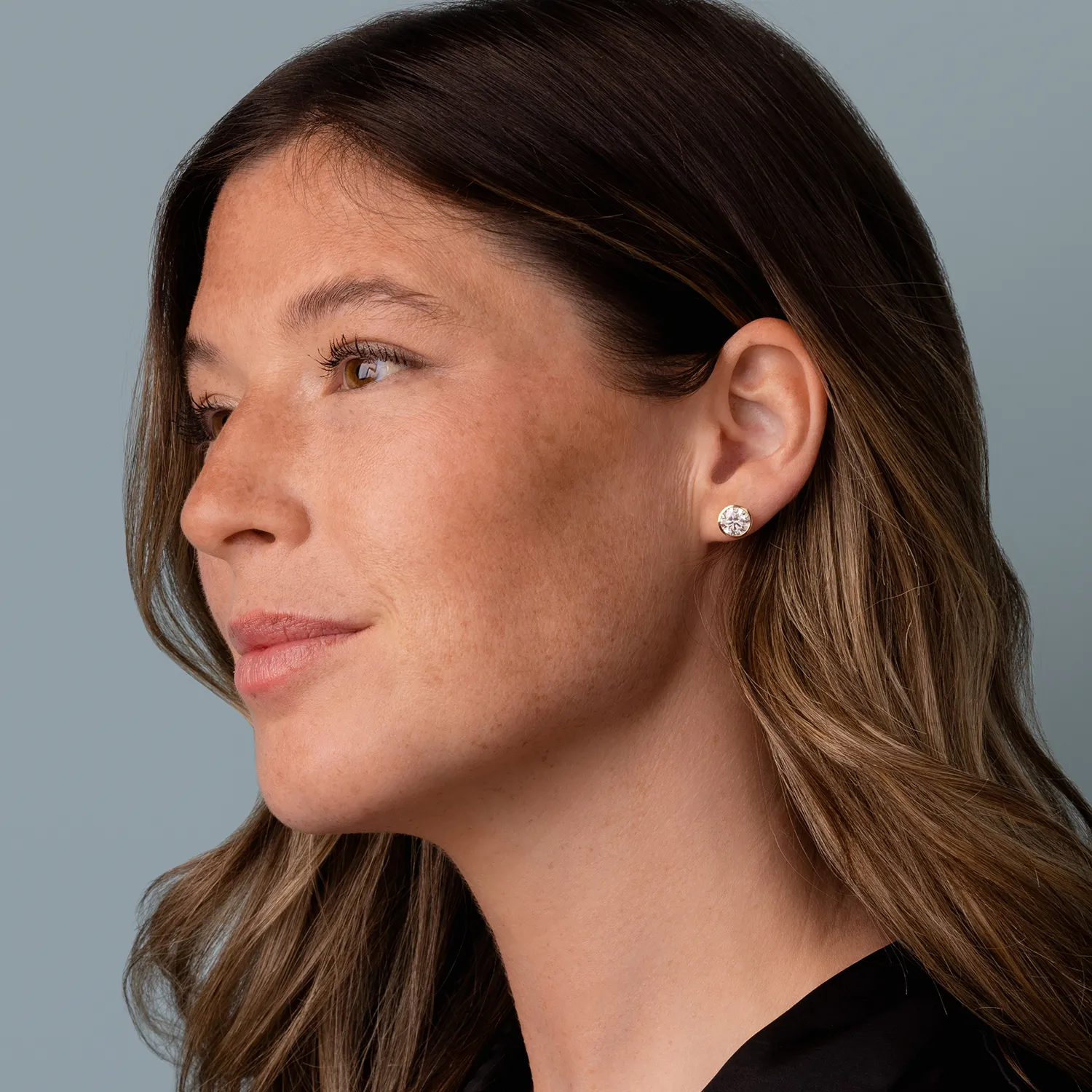 Model wearing the Diamond Bezel Stud Earrings