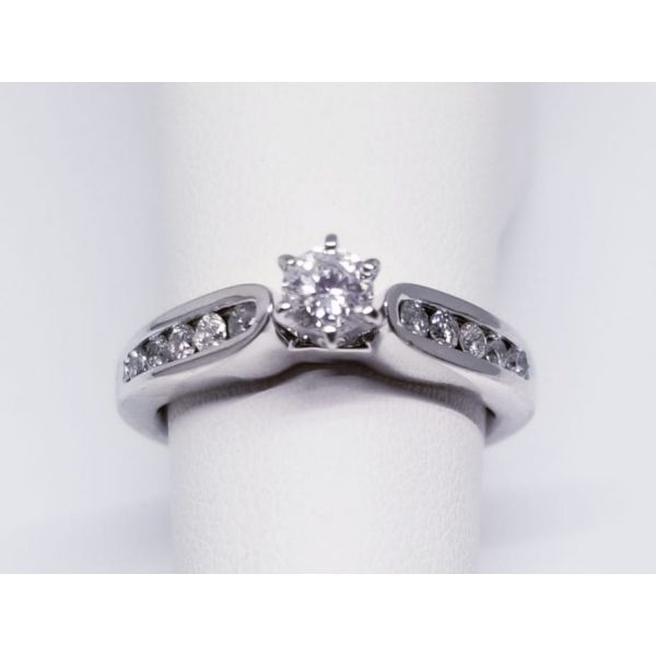 14K White Diamond Engagement Ring With One 6 Prong Set Round  Diamond 0.25 Ct And 10 Channel Set Round Diamonds 0.24 Tw. Color H Barnes Jewelers Goldsboro, NC