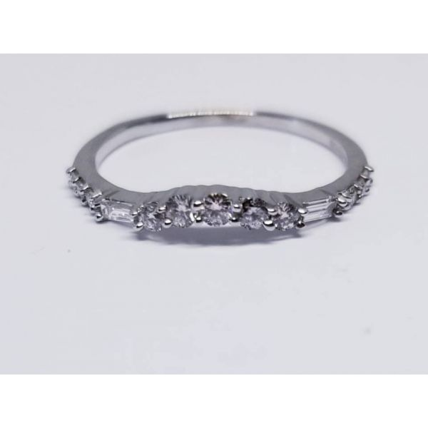14K White Curved Diamond Band/Ring. Size 6.5. with 11 Round Diamonds- 2=.04 tw, 3=.09 tw, 6= .05 tw and 2 Baguette Diamonds 0.06 Barnes Jewelers Goldsboro, NC
