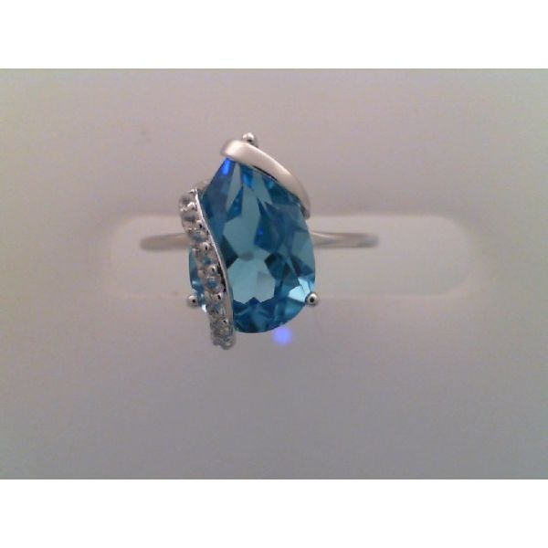 Rhodium Sterling Silver Fashion Ring w/One Pear shaped Blue Topaz 3.17 tw, and White Topazs  0.64 tw . Size 7 Barnes Jewelers Goldsboro, NC