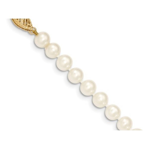 Pearl  Bracelet- 6-7mm  White  Cultured Freshwater Near Round Pearl Bracelet with 14KY Pearl Clasp. Length  7.5