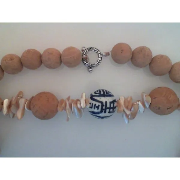 Necklace w/ Assorted Cork and  Mother of Pearl Beads and one 27mm Porcelain bead. Toggle Closure,  Apx 30