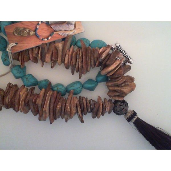 Necklace w/ Blue Howlite and coconut beads, Horse Hair Tassel and toggle closure. Length apx. 30