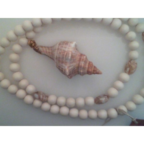 Necklace with assorted wooden and stone beads and one large shell  apx 35