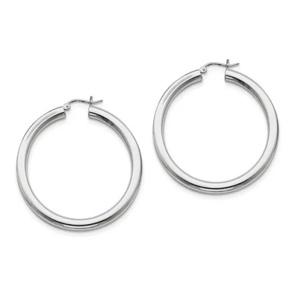 Rhodium Sterling Silver 4mm Hollow Tube Hoop Earrings. Length 47mm x Width 44mm. Polished. Hinged Post. Barnes Jewelers Goldsboro, NC