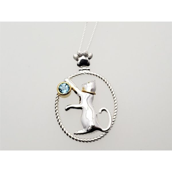 Sterling silver and vermeil pendant and chain with baby blue topaz Roberts Jewelers Jackson, TN