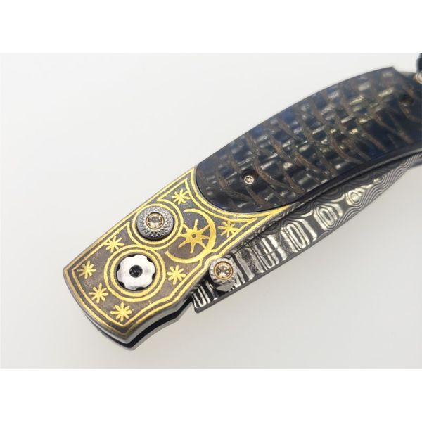 Kestrel Blue Moon with gold koftgari, blue spruce pine cone, and wave damascus Image 3 Roberts Jewelers Jackson, TN