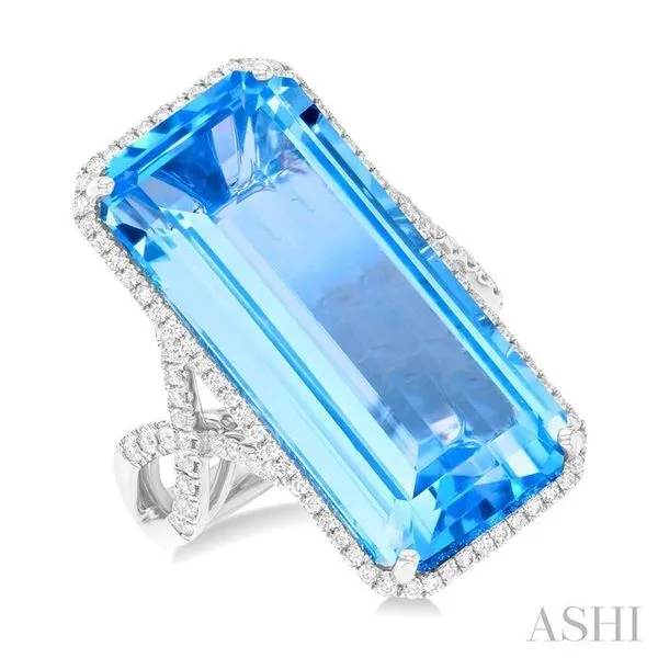 26x12 MM Emerald Cut Blue Topaz and 1/2 Ctw Round Cut Diamond Halo Semi-Precious Ring in 14K White Gold Hart's Jewelers Grants Pass, OR