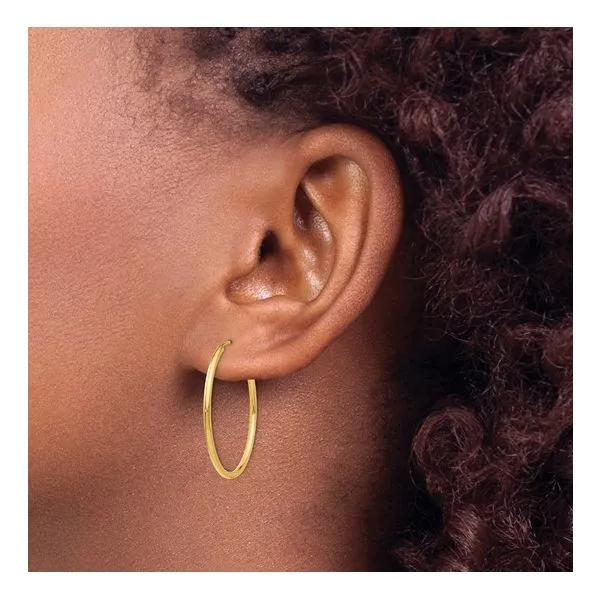 14K Yellow Gold 25mm Thin Hoop Earrings Image 3 Arezzo Jewelers Elmwood, IL