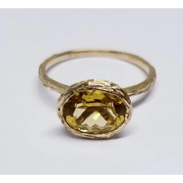 4 Karat Yellow Fashion Ring  with One Oval Citrine 7mm X 9mm. Textured Shank and Bezel. Size 7 Barnes Jewelers Goldsboro, NC