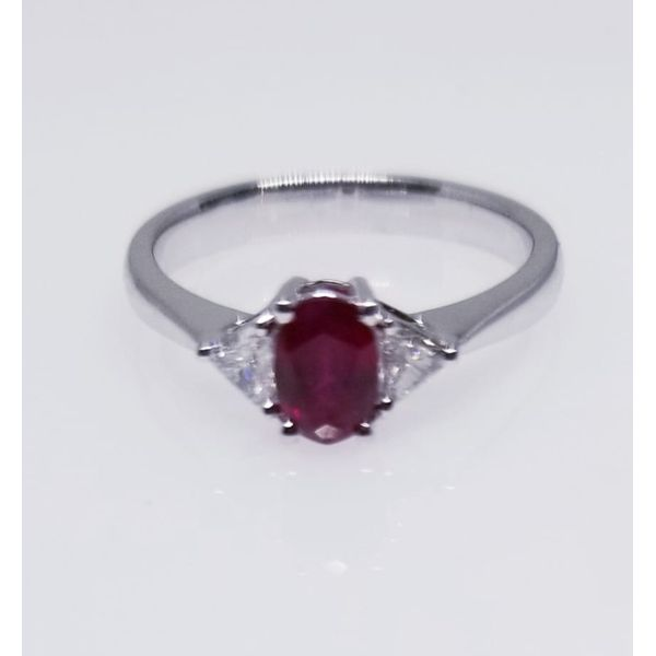 14 Karat White Ruby & Diamonds Ring With One Ruby Oval 0.50 ct  and 2 Diamonds Trillian 0.20 tw . Ring Size 6.5. Barnes Jewelers Goldsboro, NC