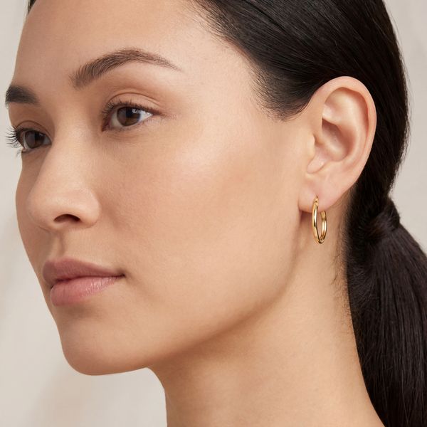 Oval Tube Hoop Earrings | 14KT Yellow Gold | Barnes Jewelers Goldsboro NC Image 3 Barnes Jewelers Goldsboro, NC