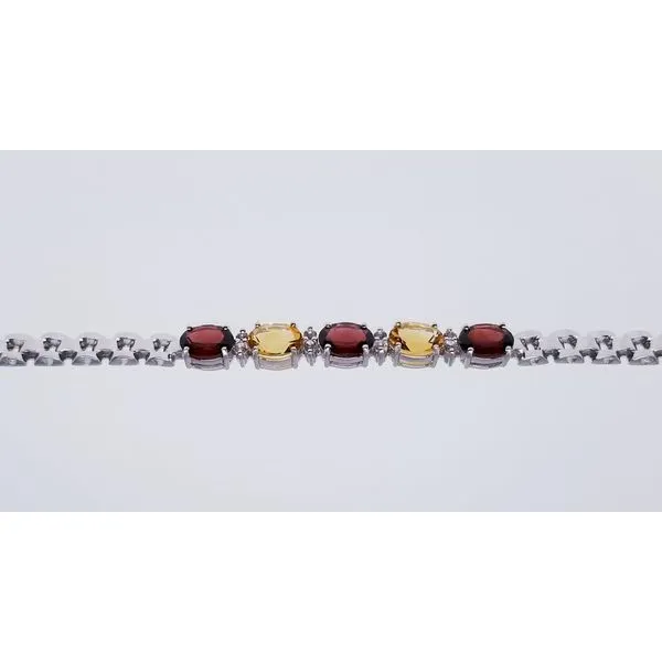 Rhodium Sterling Silver Bracelet with  8mm x 6mm Oval 3 Garnets & 2 Citrines 5.84 ctw. and 8 Round White Topaz. 0.30tw Length 7. Barnes Jewelers Goldsboro, NC