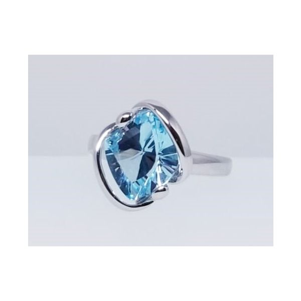 Rhodium Sterling Silver Fashion Ring With One  4.37 ct Blue Topaz. Size 7. Barnes Jewelers Goldsboro, NC