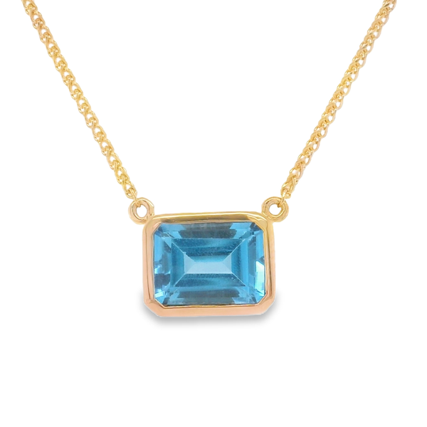14K Rose Gold Emerald Cut Blue Topaz East West Necklace 16 to 18 Inch Biondi Diamond Jewelers Aurora, CO