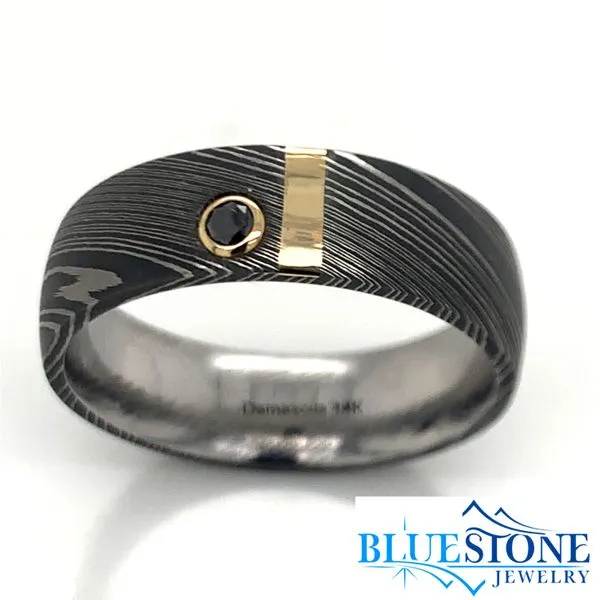 Damascus Steel 7mm Domed Band with a 2mm 14 Karat Yellow Gold Inlay and a 0.07 Carat Black Diamond. Bluestone Jewelry Tahoe City, CA