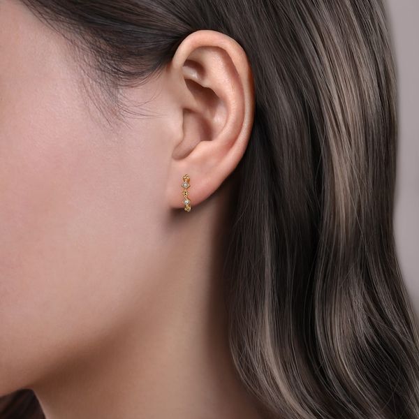 Gabriel & Co 14K Yellow Gold Diamond .04Ctw Huggie Earrings – Contemporary Collection Image 2 Bradley's Jewelers Jacksonville, NC