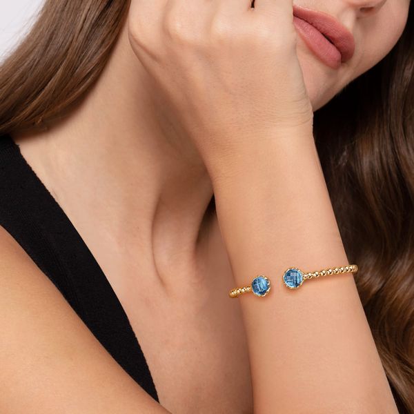 Gabriel & Co. 14K Yellow Gold Bujukan Swiss Blue Topaz Floral Split Bangle with Blue Enamel Image 5 Bradley's Jewelers Jacksonville, NC