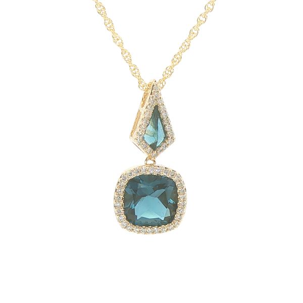 14ky kite shaped and cushion cut London Blue Topaz pendant with natural diamond accented halos create a 2.40tgw pendant showcased on an 18 inch rope c Bryan Jewelry Prattville, AL