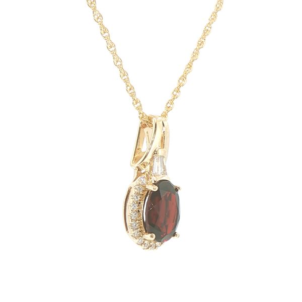 14ky 9x7mm oval garnet with halo of natural diamonds and baguette accented bail on an 18 inch rope chain with lobster clasp. Image 2 Bryan Jewelry Prattville, AL