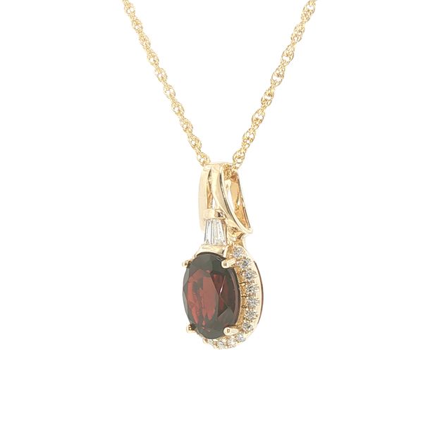 14ky 9x7mm oval garnet with halo of natural diamonds and baguette accented bail on an 18 inch rope chain with lobster clasp. Image 3 Bryan Jewelry Prattville, AL