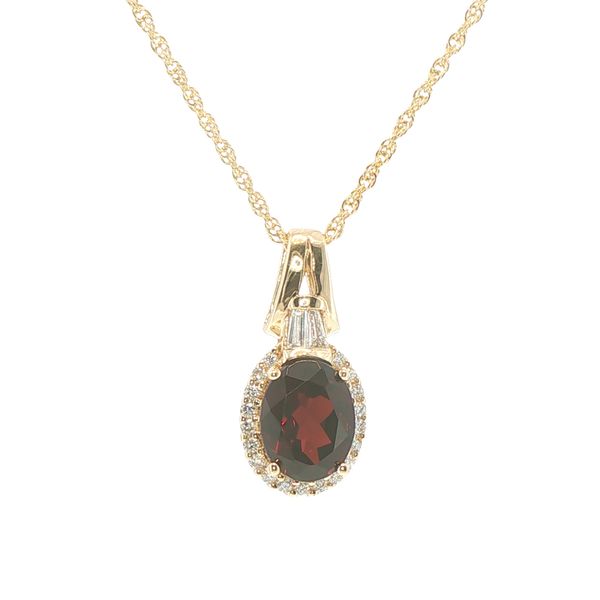 14ky 9x7mm oval garnet with halo of natural diamonds and baguette accented bail on an 18 inch rope chain with lobster clasp. Bryan Jewelry Prattville, AL