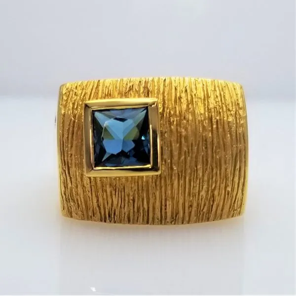 Princess Cut Blue Topaz and Single Diamond Ring in 18kt Yellow Gold Chipper's Jewelry Bonney Lake, WA