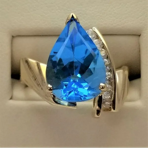 Pear Shaped Blue Topaz and Round White Topaz Ring in 10Kt Yellow Gold Chipper's Jewelry Bonney Lake, WA