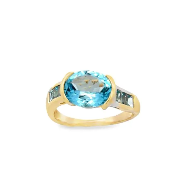 14K Yellow Gold Sky Blue Topaz Half Bezel Ring with Channel Set Baguette Shank Classic Creations In Diamonds & Gold Venice, FL
