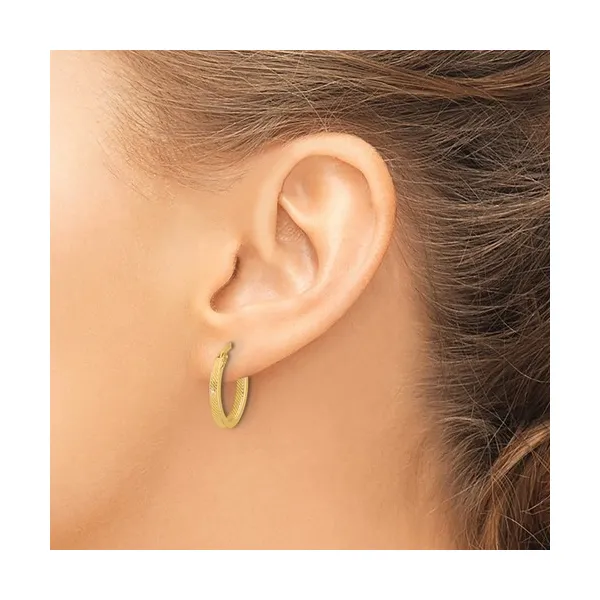 Polished and Textured Oval Hoop Earrings in 10k Yellow Gold Image 2 Conti Jewelers Endwell, NY