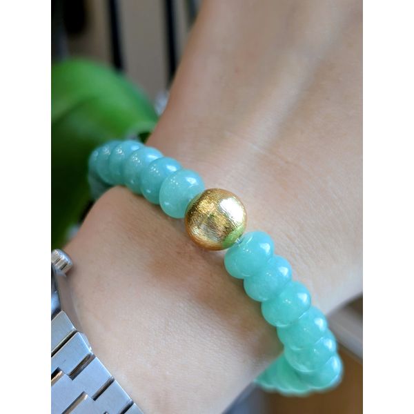 Green Slice Stretch Bracelet with Gold toned Ball Image 2 Conti Jewelers Endwell, NY