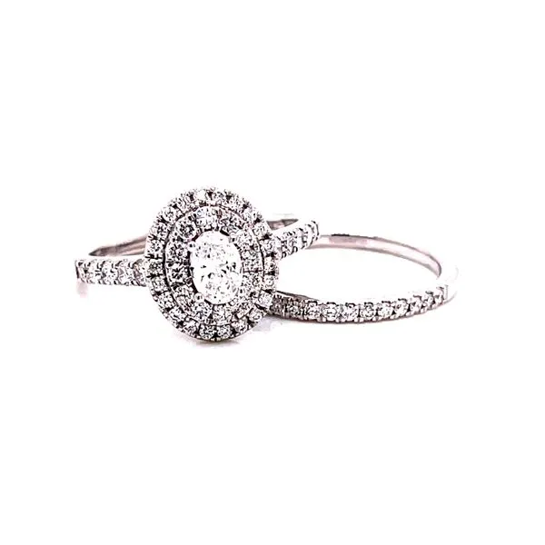 14 Karat White Gold Oval Cut Center with Double Diamond Halo Engagement Ring and Matching Diamond Band Corinth Jewelers Corinth, MS