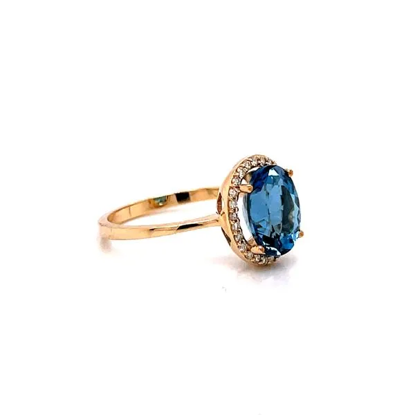 14 Karat Yellow Gold Oval Blue Topaz Fashion Ring with Diamond Halo Image 2 Corinth Jewelers Corinth, MS