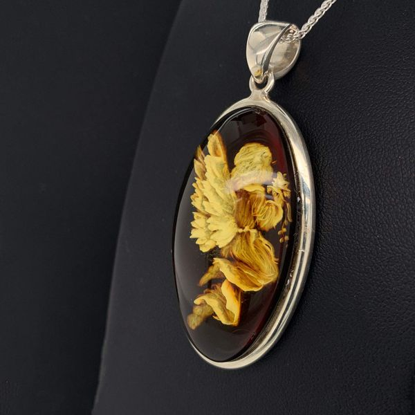 Hand Carved Amber Angel Pendant Image 2 Geralds Jewelry Oak Harbor, WA