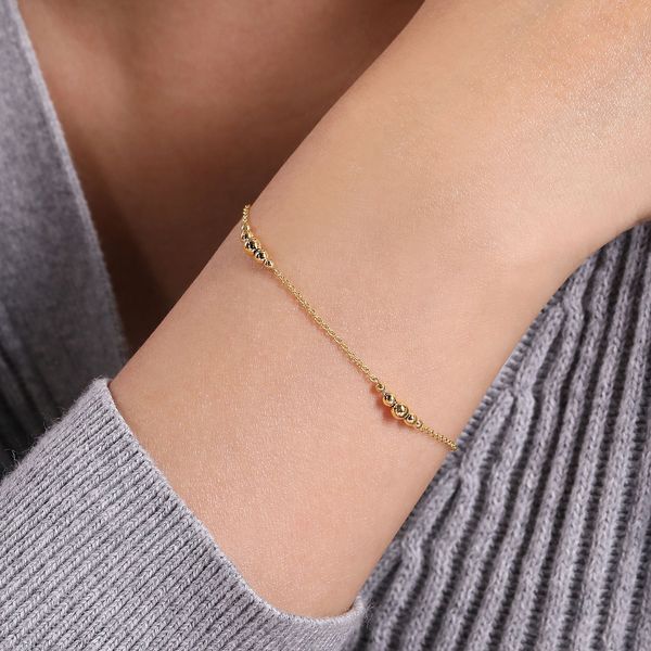 14K Yellow Gold Graduating Bead Stations Bracelet Image 3 Gray's Jewelers Bespoke Saint James, NY
