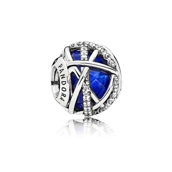 Charm in sterling silver with encased faceted royal blue crystal and clear CZ Harmony Jewellers Grimsby, ON
