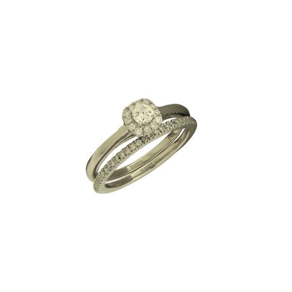 Straight line diamond wedding set featuring a halo design engagement ring. Holliday Jewelry Klamath Falls, OR