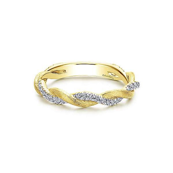 Diamonds twist around high polish yellow gold in this Gabriel & Co. stackable band. Holliday Jewelry Klamath Falls, OR