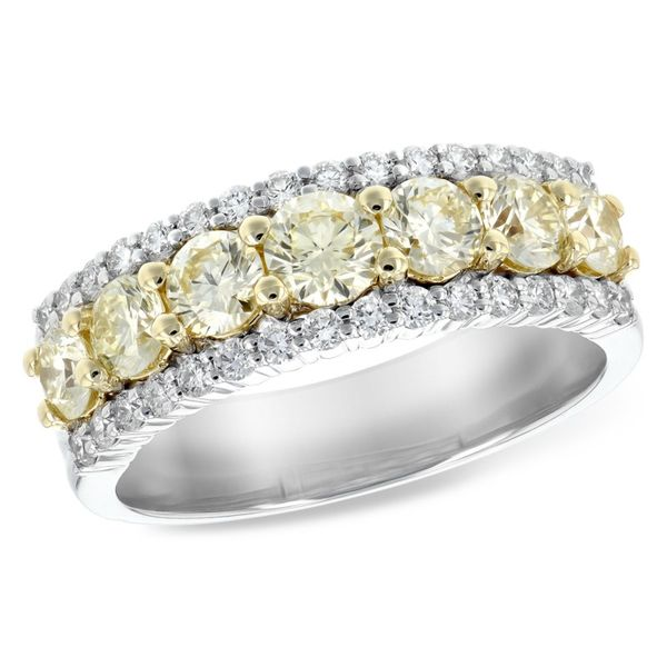 Natural colored yellow diamonds surrounded by white diamonds in white gold. Holliday Jewelry Klamath Falls, OR