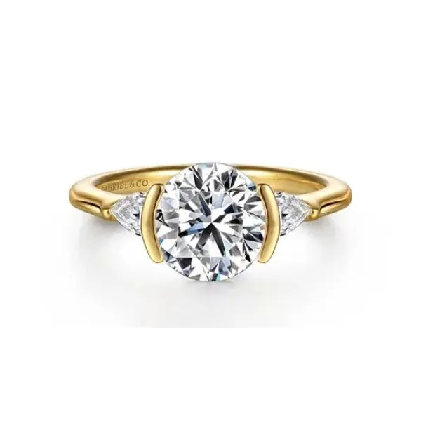 Pear shaped accented three stone diamond ring. *Center not included. Holliday Jewelry Klamath Falls, OR