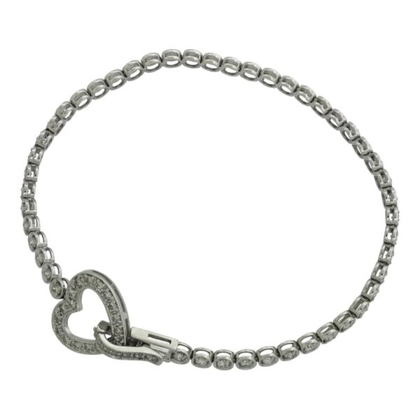 Diamond tennis bracelet with heart shaped clasp in white gold. Holliday Jewelry Klamath Falls, OR