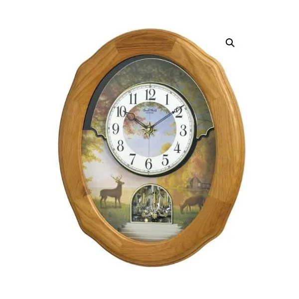 Joyful Sunset is the background graced with a beautiful serene painting of a buck and a doe by a lake house. The face splits in two and revolves in a  Holliday Jewelry Klamath Falls, OR