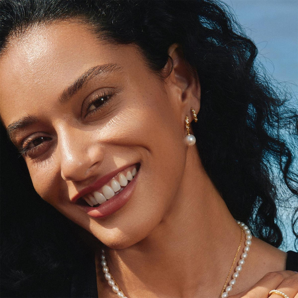 Luna Gaze Gold Sparkle Twisted Huggie Hoop Earrings Image 2 House of Silva Wooster, OH