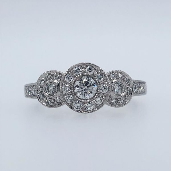 14k white gold and 0.50cttw diamonds ring. The ring features a three stone halo style design with milgrain edges. Diamonds are s Hudson Valley Goldsmith New Paltz, NY