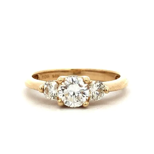 This 14Kt yellow gold engagement ring features a 0.67ct round natural diamond center stone, with two round natural diamonds on each side. The total diamond weight is 1.00cttw, with a G-H color and SI1 clarity. Hudson Valley Goldsmith New Paltz, NY