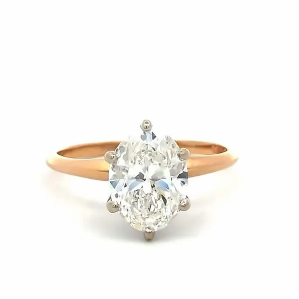 Crafted in 14Kt yellow gold, this solitaire engagement ring features a 2.01ct natural oval diamond. The diamond is certified by IGI and has a color grade of F and a clarity grade of SI2. The measurements of the diamond are 9.58x7.10mm. Hudson Valley Goldsmith New Paltz, NY