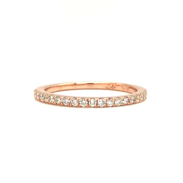 14k rose gold straight band featuring 0.25cttw round brilliant diamonds hand set along the top half of the ring. Hudson Valley Goldsmith New Paltz, NY