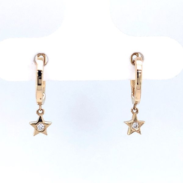 14k yellow gold small huggie style earrings featuring a star drop with flush set 0.02cttw diamonds in the center of the design Hudson Valley Goldsmith New Paltz, NY