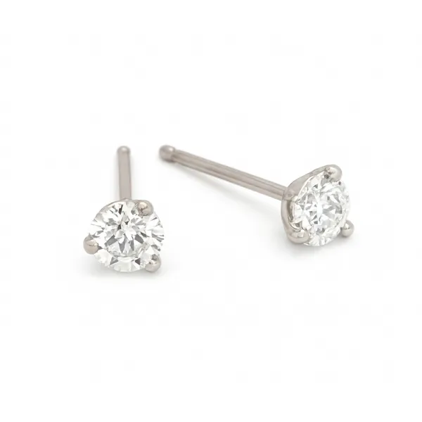 These 14Kt white gold diamond earrings feature 1/4Ctw round natural diamonds set in martini style settings. The diamonds have a quality of G/H SI2. Hudson Valley Goldsmith New Paltz, NY