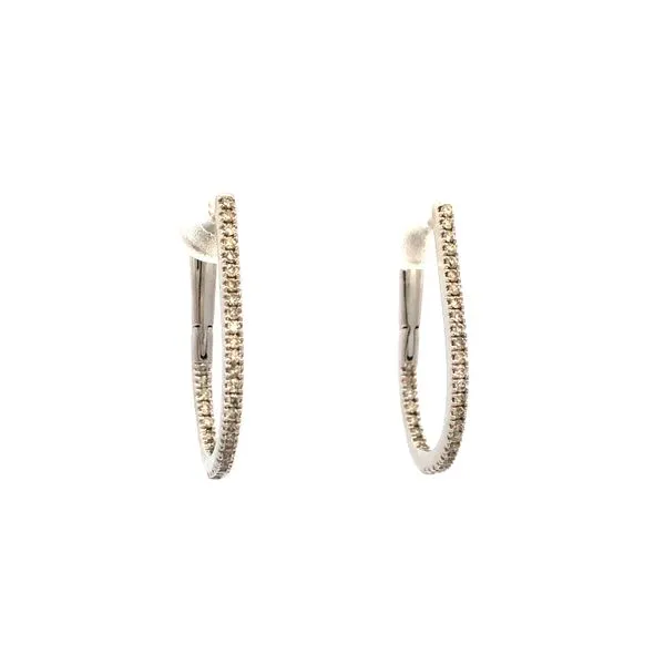 These 14K white gold curve hoop earrings feature.25ctw diamonds inside and out. The diamonds add a touch of sparkle and elegance to the classic hoop design. Perfect for both casual and formal occasions, these earrings are a versatile addition to any jewel Hudson Valley Goldsmith New Paltz, NY